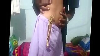 a man licking women navel